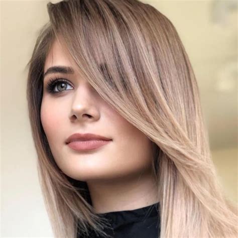 The best way to avoid flat framing is to add an angled fringe. The short to long layering stacks your framing, building volume and opening up your hair. This gives your layers a fuller appearance. Ask your stylist for their recommendation on a bang length. You will want it to compliment your face shape.